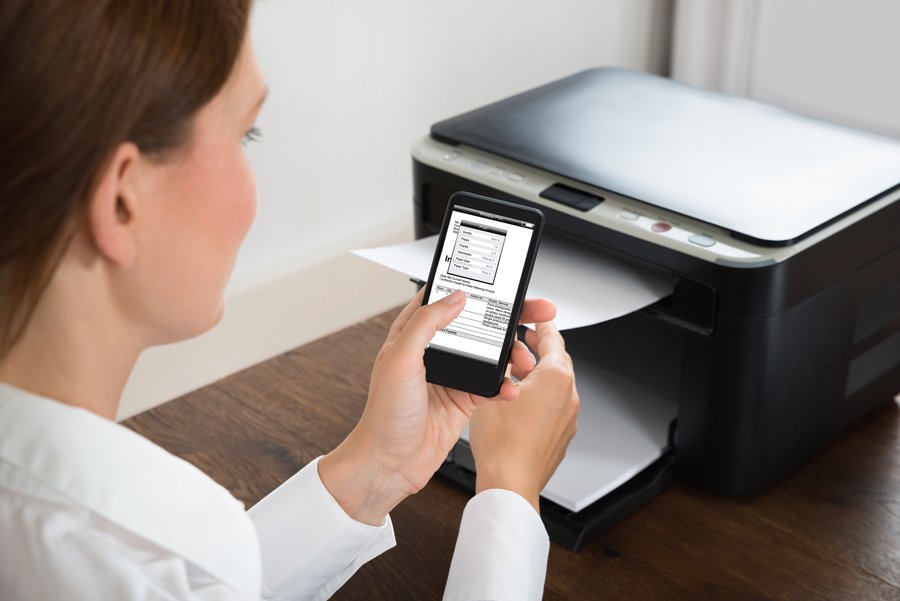 a woman using a wireless printer